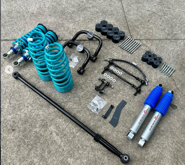 Suspension and lift kit components laid out before installation